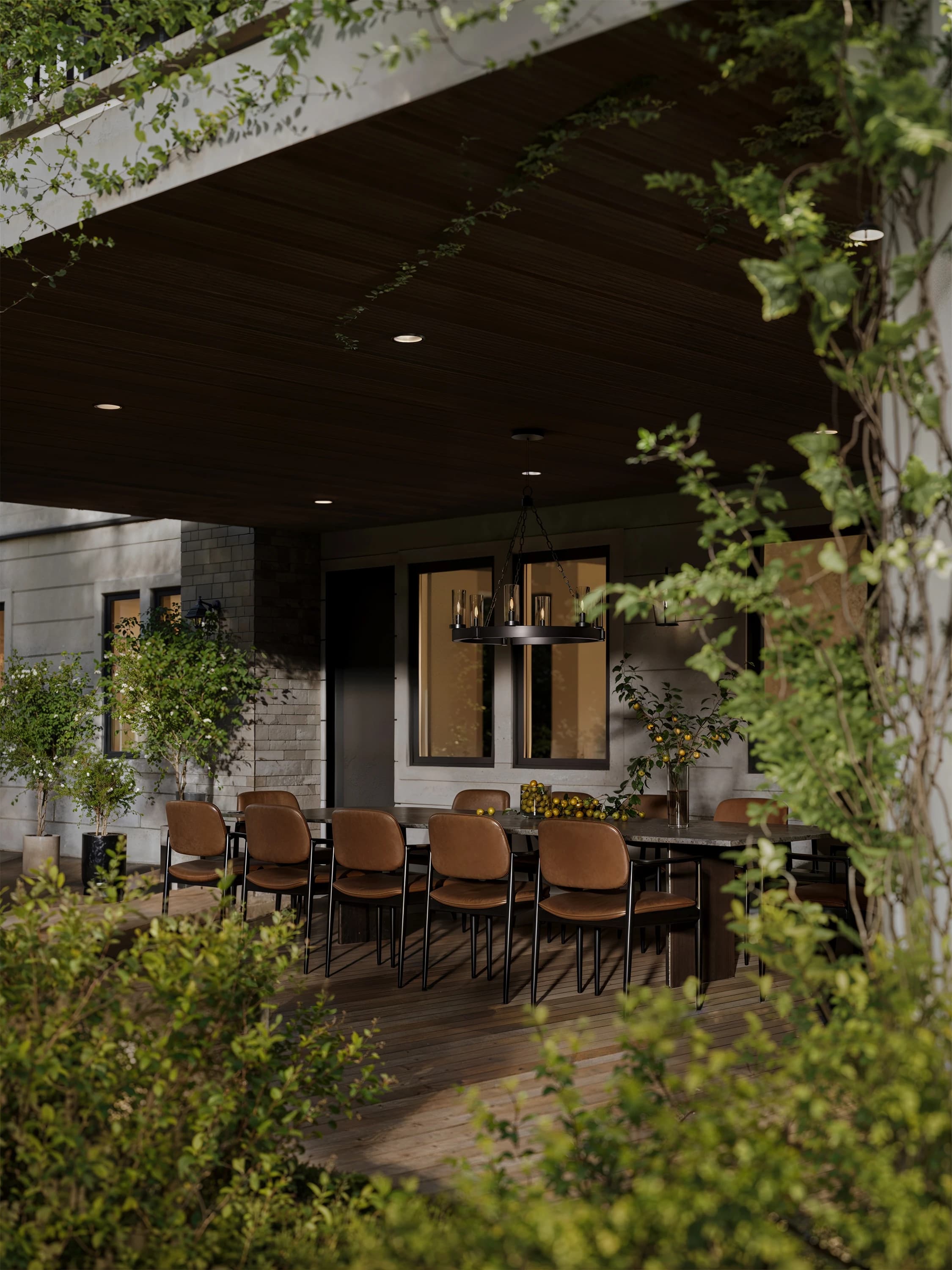 Covered outdoor dining terrace surrounded by greenery